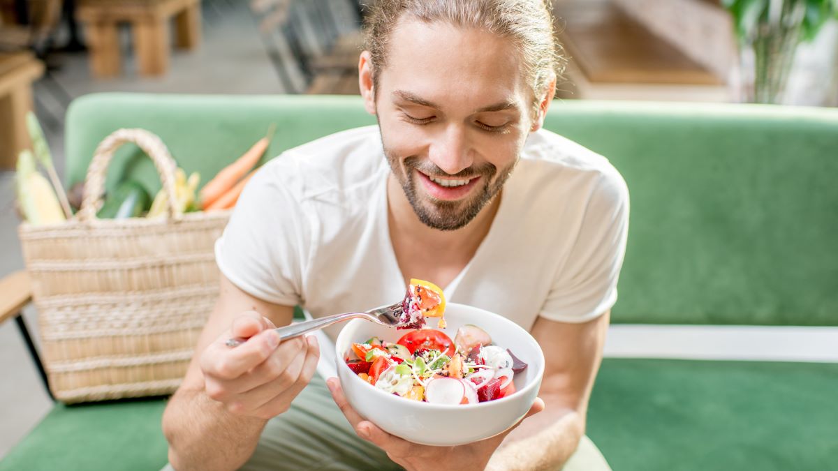 young man eating vegetarian food