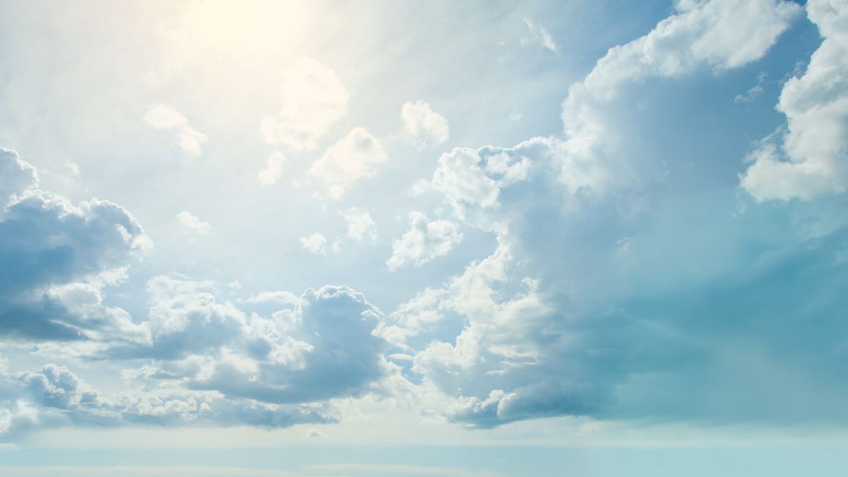 sun peaking through cloudy sky