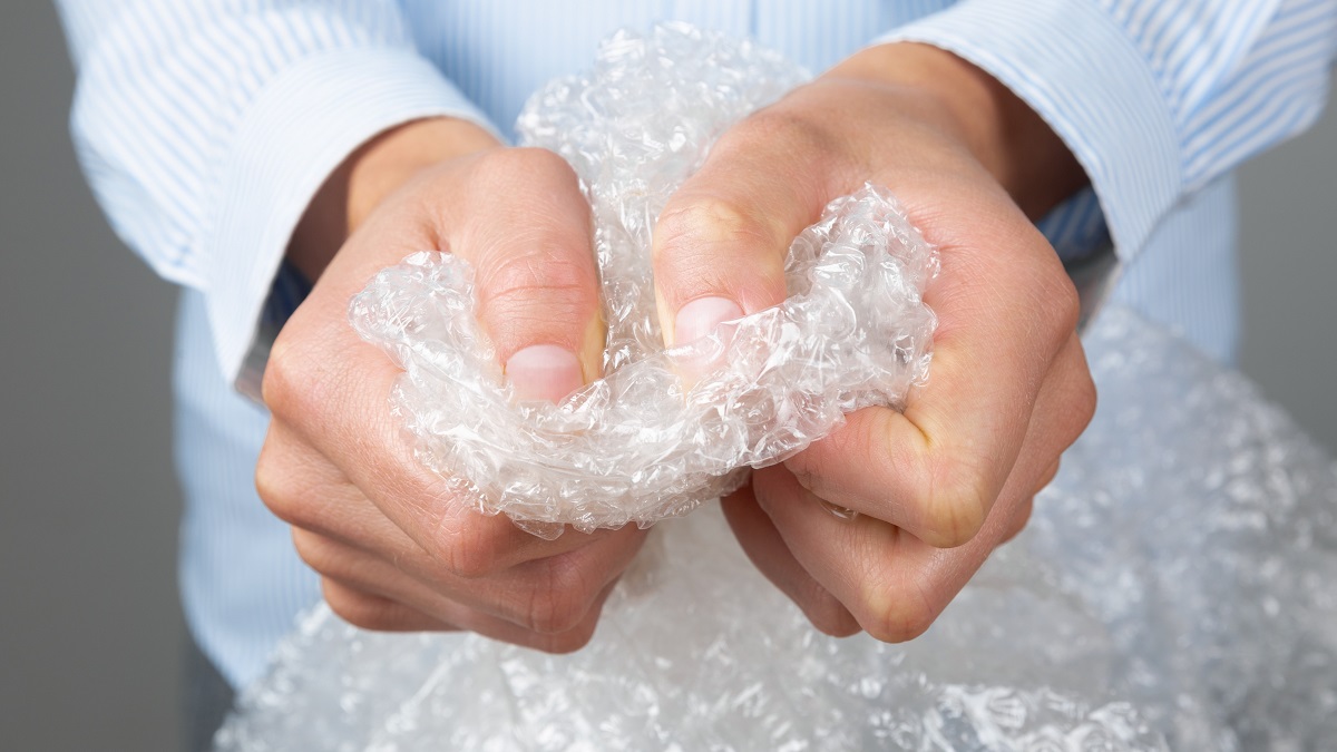 Man's hands holding Bubble Wrap