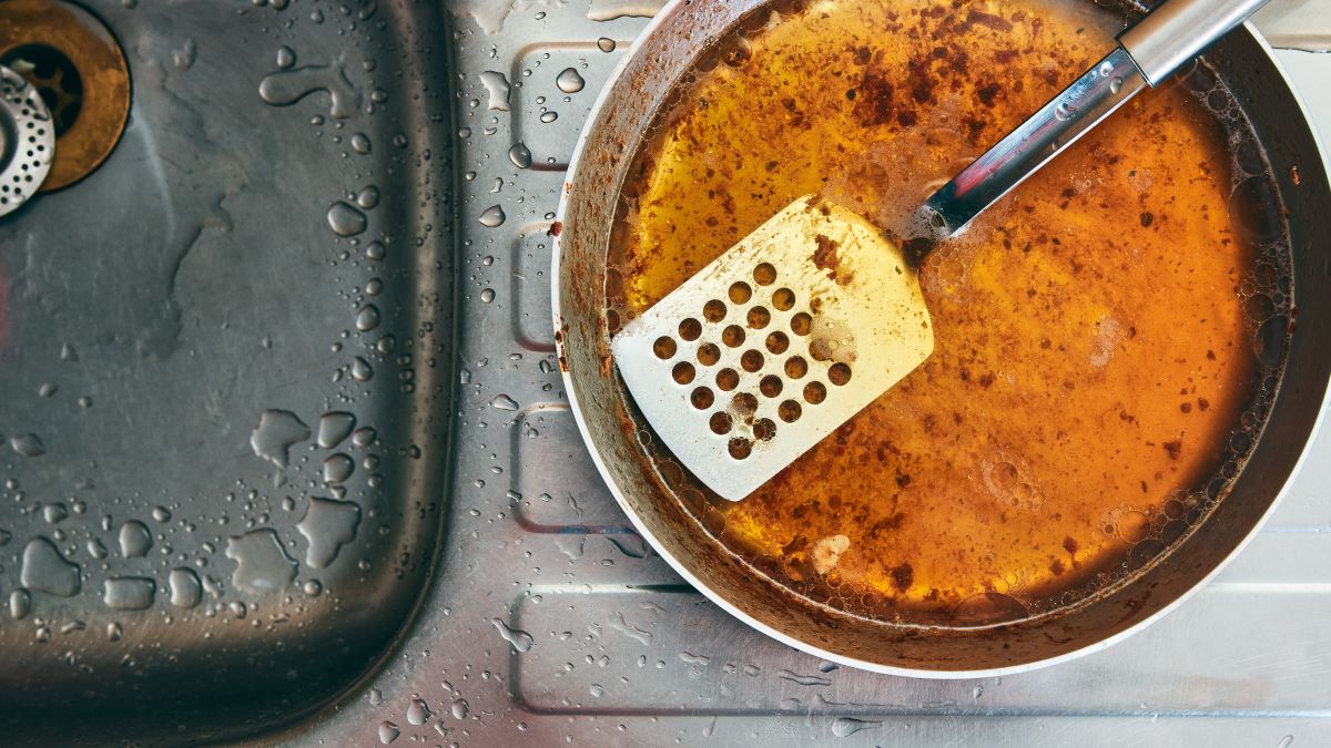 pan of cooking oil next to the sink