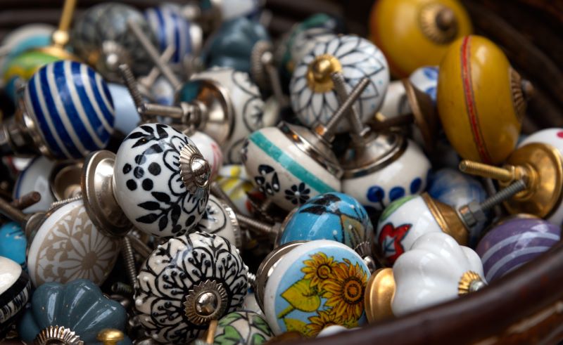 Tub full of vintage ceramic pull knobs