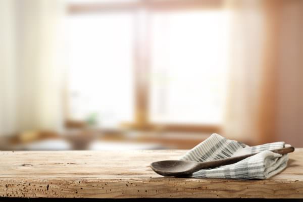 Cloth napkin and wooden spoon in kitchen
